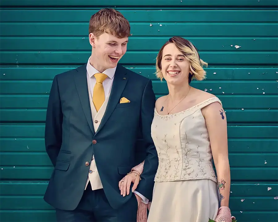 Couple smiling outside registry office ceremony in The Hive, Worcester Couple smiling outside registry office ceremony in The Hive, Worcester