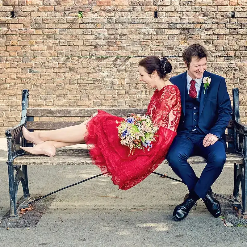 Newlyweds sitting on a bench by the River Severn in Worcester Newlyweds sitting on a bench by the River Severn in Worcester