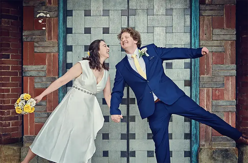Newlyweds laughing outside registry office in Worcester Newlyweds laughing outside registry office in Worcester